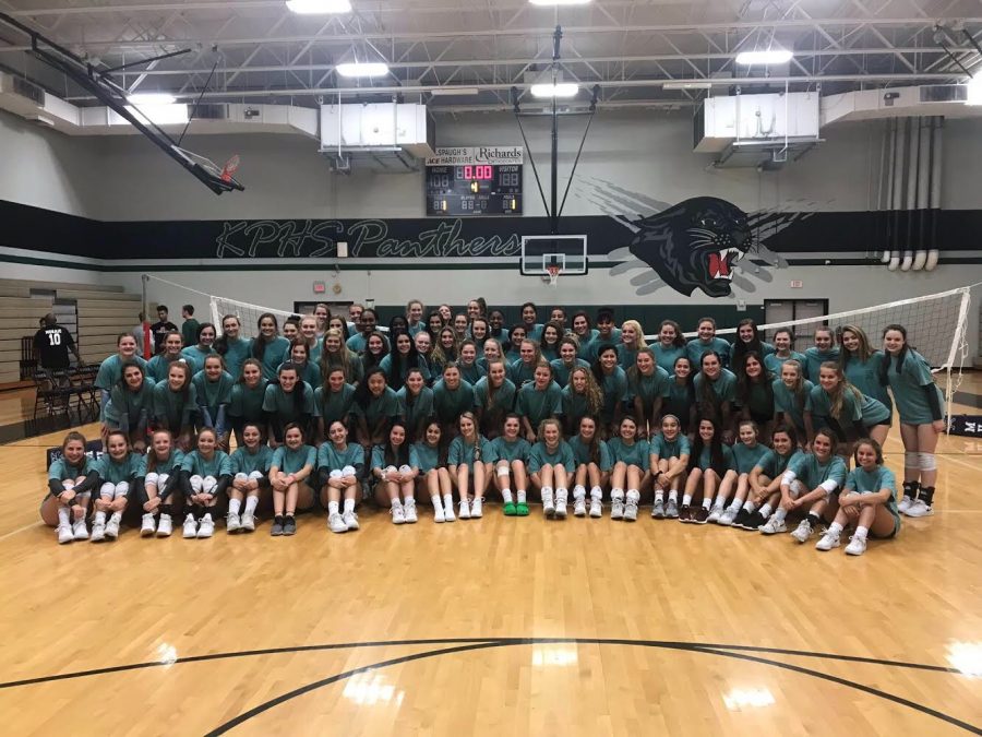 Kingwood and Kingwood Park volleyball programs wear the same shirt sporting the phrase “One Team, One Family”.