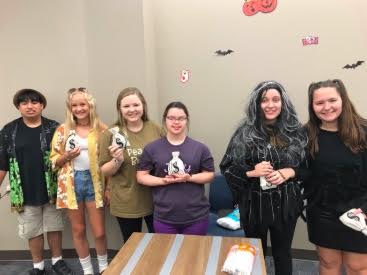 Students hanging out at the Mustang Pals Halloween Social