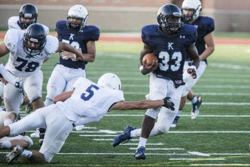 Sewo Olonilua leads Blue past White at Kingwood spring game, 2014. 