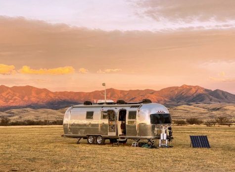 The Longnecker family's Airstream in front of the mountains of Arizona.