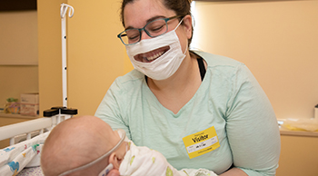 YNHCH’s Neonatal Intensive Care Unit is implementing the use of clear face masks to help newborns learn visual cues that correlate with development. (Yale New Haven Health)