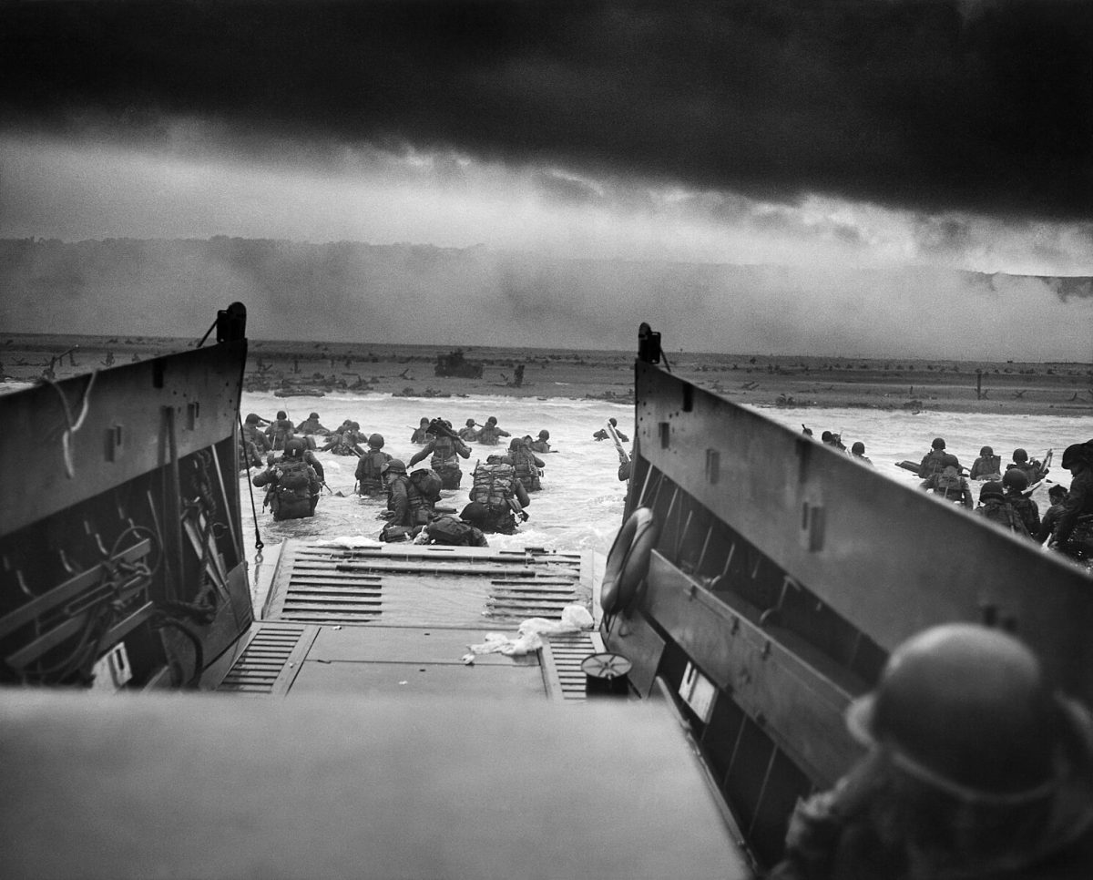 US+soldiers+wade+through+surf+and+German+gunfire+to+secure+a+beachhead+during+the+Allied+Invasion%2C+on+the+beaches+of+Normandy+on+June+6%2C1944.+