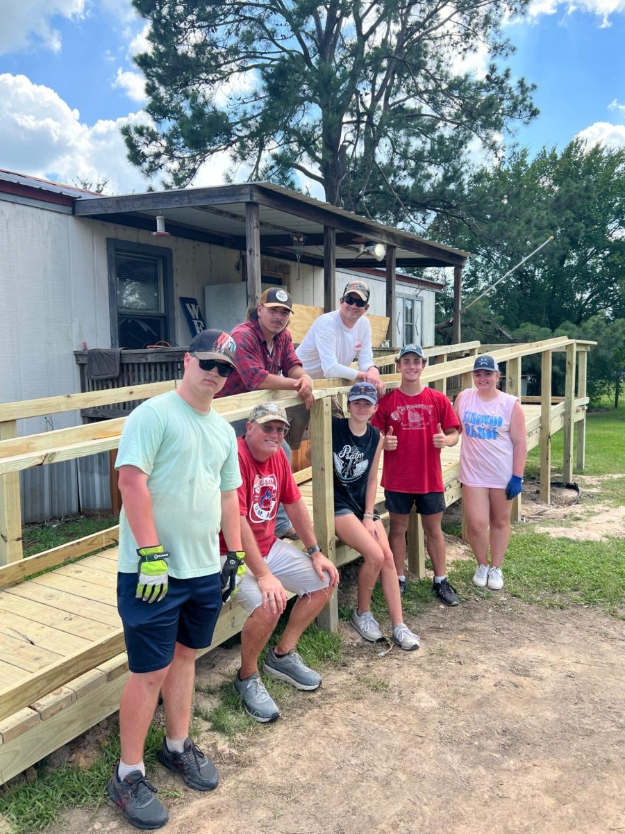 Work leader Kurt Cradic and team showoff the new wheelchair ramp.  